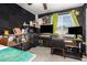 This home office features storage, a ceiling fan, neutral colors, and dual monitors at 15423 N 22Nd Dr, Phoenix, AZ 85023