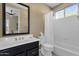 Bathroom with a black vanity, white sink, and a shower with a white curtain at 15608 E Chaparral Way, Fountain Hills, AZ 85268
