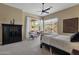 Bedroom featuring a seating area, ceiling fan, and large sunny windows at 15608 E Chaparral Way, Fountain Hills, AZ 85268