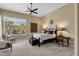 Bedroom featuring a seating area, a ceiling fan, and a writing desk at 15608 E Chaparral Way, Fountain Hills, AZ 85268