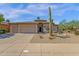 Beautiful single-story home showcasing desert landscaping, a three-car garage, and an inviting entrance at 15608 E Chaparral Way, Fountain Hills, AZ 85268