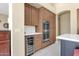 Gourmet kitchen with stainless steel appliances, including double ovens and a wine cooler at 15608 E Chaparral Way, Fountain Hills, AZ 85268