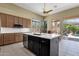 Open kitchen with an island with sink, and sliding doors to the patio at 15608 E Chaparral Way, Fountain Hills, AZ 85268