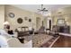 Comfortable living room with a ceiling fan, neutral walls, and stylish decor and furnishings at 15608 E Chaparral Way, Fountain Hills, AZ 85268