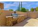 Built-in outdoor grill with stone surround and plenty of counter space for food prep at 15608 E Chaparral Way, Fountain Hills, AZ 85268