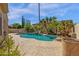 Inviting pool with lush tropical landscaping, waterfalls, and a relaxing atmosphere at 15608 E Chaparral Way, Fountain Hills, AZ 85268