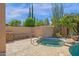 Backyard spa with a lush desert plants and stone accents at 15608 E Chaparral Way, Fountain Hills, AZ 85268