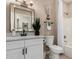 Well-lit bathroom with a modern vanity, decorative mirror, and tub-shower combination at 15691 W Arbor Trl, Surprise, AZ 85374