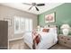 Cozy bedroom featuring a comfortable bed, shuttered windows, and stylish decor at 15691 W Arbor Trl, Surprise, AZ 85374