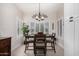 Dining room features a table, chairs, and plantation shutters at 15691 W Arbor Trl, Surprise, AZ 85374