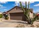 A charming single Gathering home featuring a desert landscape and tile roof at 15691 W Arbor Trl, Surprise, AZ 85374