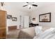 Spacious bedroom featuring a ceiling fan, natural light, and furniture at 15691 W Arbor Trl, Surprise, AZ 85374