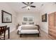 Spacious bedroom with a ceiling fan, neutral decor, and natural light at 15691 W Arbor Trl, Surprise, AZ 85374
