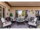 Covered patio featuring comfortable seating and an inviting outdoor space at 15691 W Arbor Trl, Surprise, AZ 85374