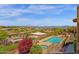 Aerial view of the community with a sparkling pool, green landscaping, and mountain views at 15834 E Sunflower Dr # 2, Fountain Hills, AZ 85268