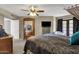 Well-decorated bedroom featuring a dresser, TV, carpet and access to an outdoor patio at 15834 E Sunflower Dr # 2, Fountain Hills, AZ 85268