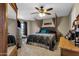 Inviting bedroom featuring a canopy bed, soft carpet, bedside tables, and a view of the outside at 15834 E Sunflower Dr # 2, Fountain Hills, AZ 85268