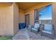 Inviting front porch with seating area and views of the mountains and community pool at 15834 E Sunflower Dr # 2, Fountain Hills, AZ 85268