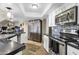 Bright kitchen featuring stainless steel appliances, white cabinets, and dark countertops with mosaic backsplash at 15834 E Sunflower Dr # 2, Fountain Hills, AZ 85268
