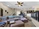 Open living room featuring a sectional sofa, staircase, and access to the kitchen at 15834 E Sunflower Dr # 2, Fountain Hills, AZ 85268
