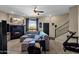 Cozy living room with a brick fireplace, comfortable sectional sofa, and staircase at 15834 E Sunflower Dr # 2, Fountain Hills, AZ 85268