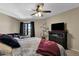 Spacious main bedroom with fan, dark dresser, and balcony access at 15834 E Sunflower Dr # 2, Fountain Hills, AZ 85268
