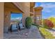 Cozy patio seating area with comfortable chairs and beautiful desert landscaping, perfect for relaxation at 15834 E Sunflower Dr # 2, Fountain Hills, AZ 85268