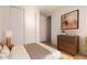 Bedroom featuring plush carpet, neutral walls, a large closet, and a dresser for clothing storage at 16448 W Tether Trl, Surprise, AZ 85387
