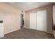 Cozy bedroom featuring carpet and a closet with plenty of room for storage at 16814 N 31St Ave, Phoenix, AZ 85053