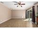 Bright and airy bonus room featuring tile floors, a ceiling fan, and sliding glass doors at 16814 N 31St Ave, Phoenix, AZ 85053