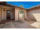 Inviting front porch with brick flooring, seating, and a decorative window at 16814 N 31St Ave, Phoenix, AZ 85053