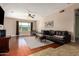 Bright living room with hardwood floors, a ceiling fan, and comfortable seating at 16814 N 31St Ave, Phoenix, AZ 85053