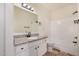 Well lit bathroom with granite counters, neutral wall and tile flooring and a shower-tub combo at 1825 W Ray Rd # 2111, Chandler, AZ 85224