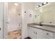 Bathroom featuring a granite vanity, white cabinets, and a tiled shower-tub combo at 1825 W Ray Rd # 2111, Chandler, AZ 85224