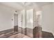 Bright bedroom featuring hardwood floors, neutral walls, and ensuite access at 1825 W Ray Rd # 2111, Chandler, AZ 85224