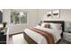 Cozy bedroom showcases a queen-size bed, neutral tones, and picturesque window view for a relaxing atmosphere at 1825 W Ray Rd # 2111, Chandler, AZ 85224