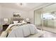 Stylish bedroom featuring a plush bed, modern decor, and a sliding glass door that offers beautiful outdoor scenery at 1825 W Ray Rd # 2111, Chandler, AZ 85224