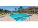 Resort-style community pool with spa, lounge chairs, and lake view at 1825 W Ray Rd # 2111, Chandler, AZ 85224