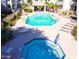 Aerial view of the community pool, spa, lounge area, and manicured landscaping at 1825 W Ray Rd # 2111, Chandler, AZ 85224