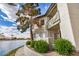 Stunning exterior view of condo featuring beautiful waterfront views and lush landscaping for a peaceful setting at 1825 W Ray Rd # 2111, Chandler, AZ 85224