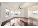 Bright and open living room with beautiful dark wood floors, multiple windows, and ample natural light at 1825 W Ray Rd # 2111, Chandler, AZ 85224