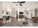 Open-concept living room with hardwood floors, ceiling fan, and a view into the kitchen space at 1825 W Ray Rd # 2111, Chandler, AZ 85224