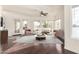 Bright living room boasts hardwood floors, neutral furniture, natural light, and tranquil water views at 1825 W Ray Rd # 2111, Chandler, AZ 85224