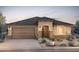 Charming single-story home with a two-car garage and desert landscaping at 18667 N 268Th Ave, Buckeye, AZ 85396