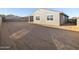 New construction backyard offers a spacious area ready for personalization and landscaping at 20279 N 224Th Dr, Surprise, AZ 85387