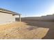 Wide view of the spacious backyard with privacy wall at 20279 N 224Th Dr, Surprise, AZ 85387