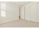Bedroom featuring a closet and neutral carpet at 20279 N 224Th Dr, Surprise, AZ 85387