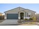 Charming single story home with a well-maintained desert landscape and a covered entryway at 20279 N 224Th Dr, Surprise, AZ 85387