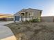 Beautiful single-story home with desert landscaping and a two-car garage at 20279 N 224Th Dr, Surprise, AZ 85387