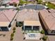 Aerial view of an outdoor patio with a seating area, artificial grass, and desert landscaping at 21090 N 267Th Dr, Buckeye, AZ 85396
